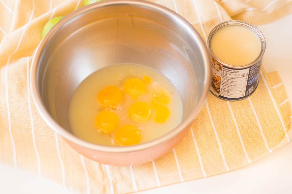eggs in bowl next to condensed milk