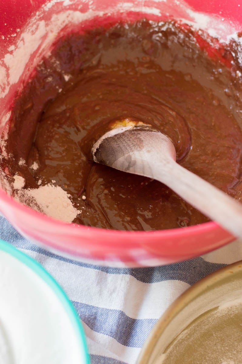 cake batter with chocolate in red bowl