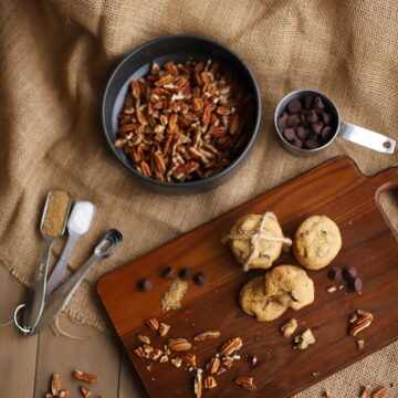chocolate chip pecan cookies on a wood board