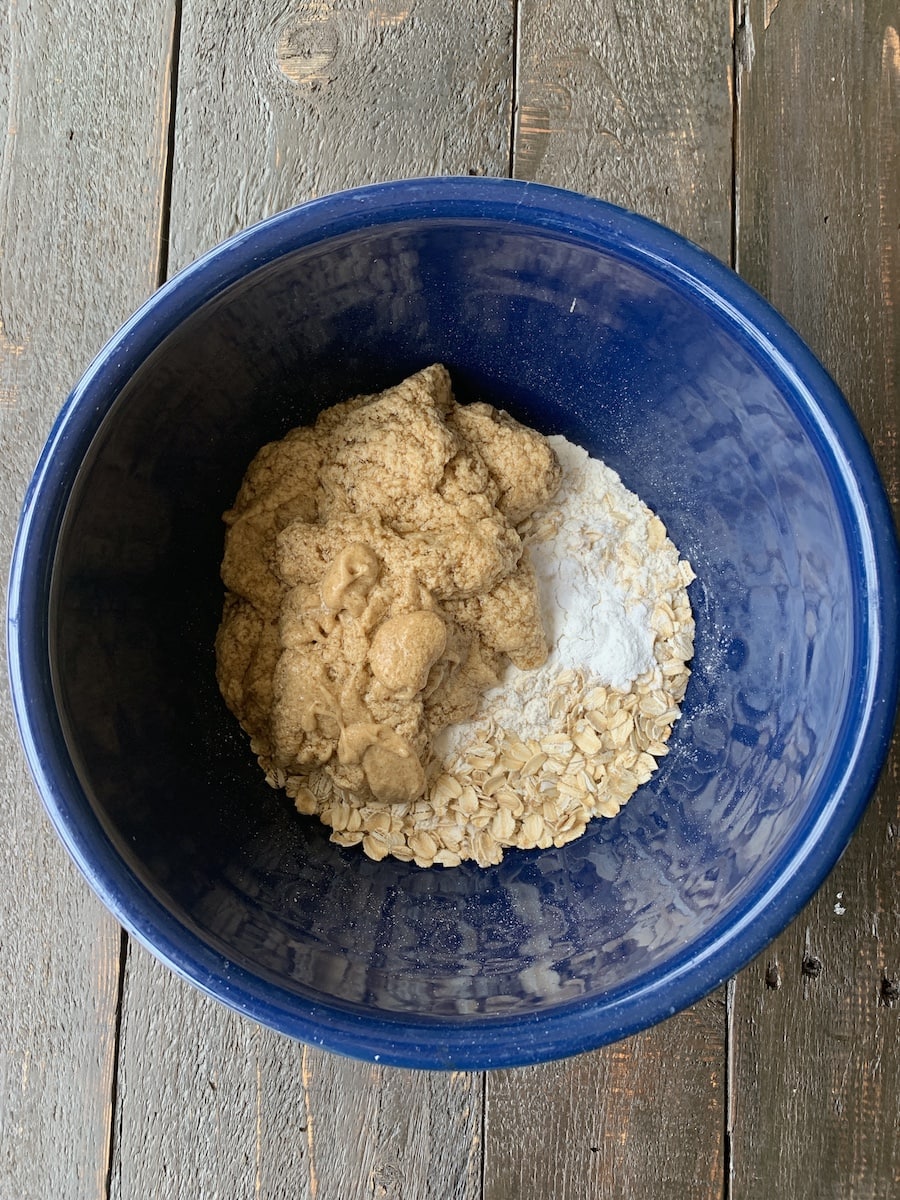 oatmeal raisin cookies wet and dry in blue bowl