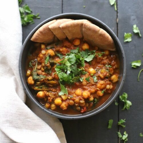 lentil dahl on a black table with napkin