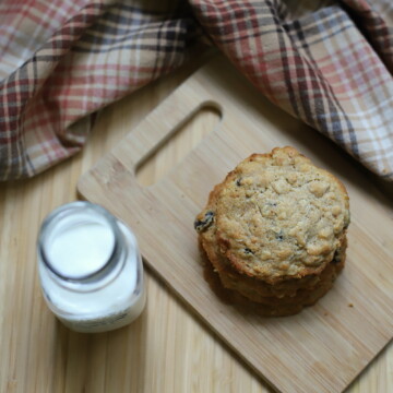 oatmeal raisin cookies with honey on cutting board