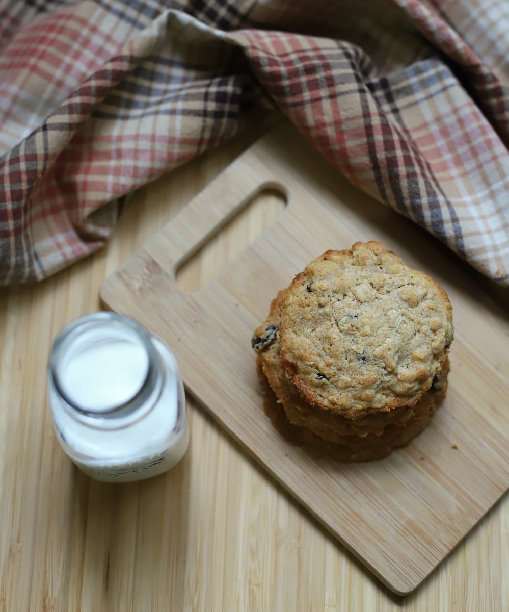 oatmeal raisin cookies with honey on cutting board