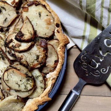 Irish Potato Pie in pan with pie spatula.