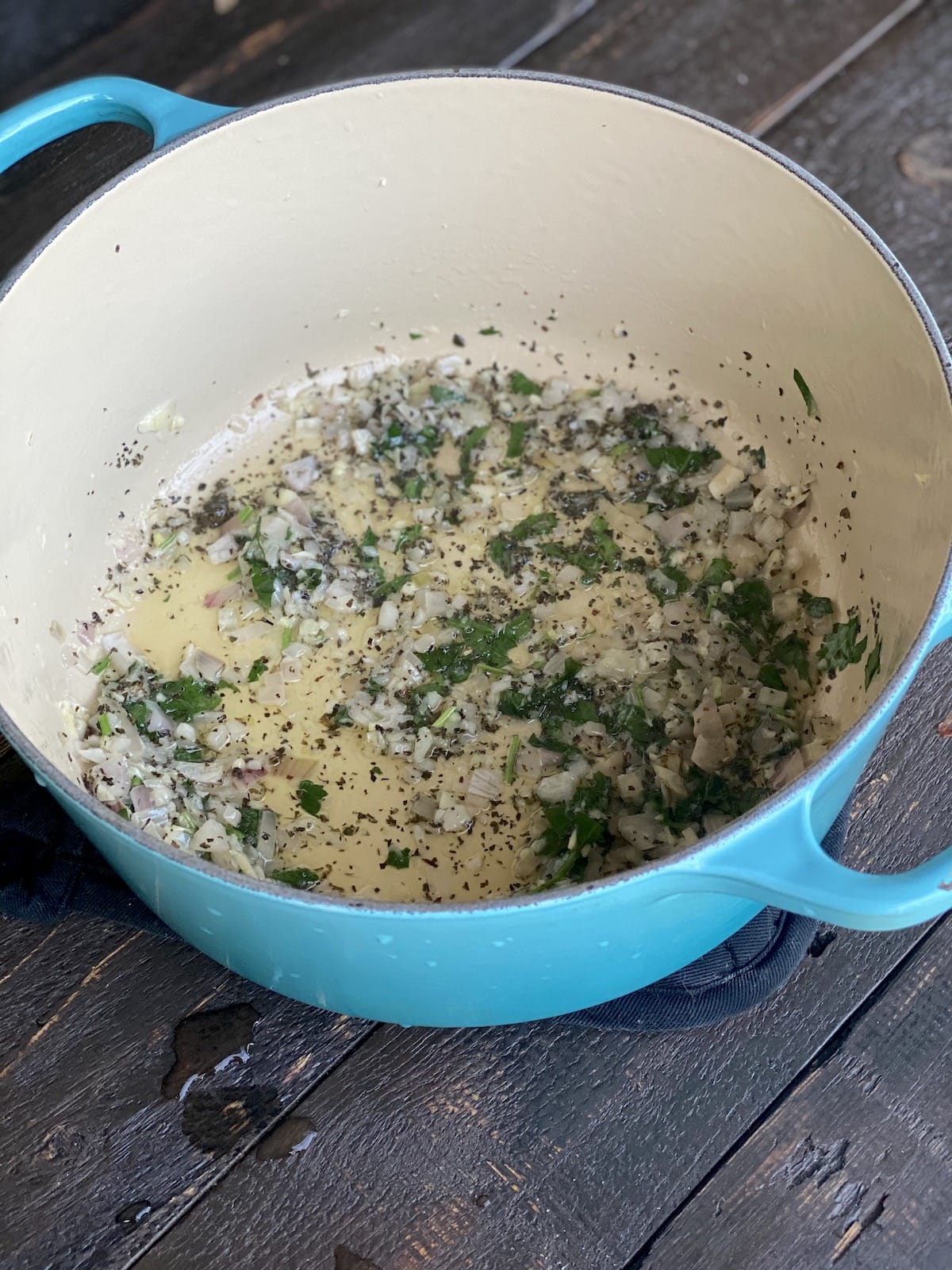 Shallots, garlic, butter, and parsley cooking.
