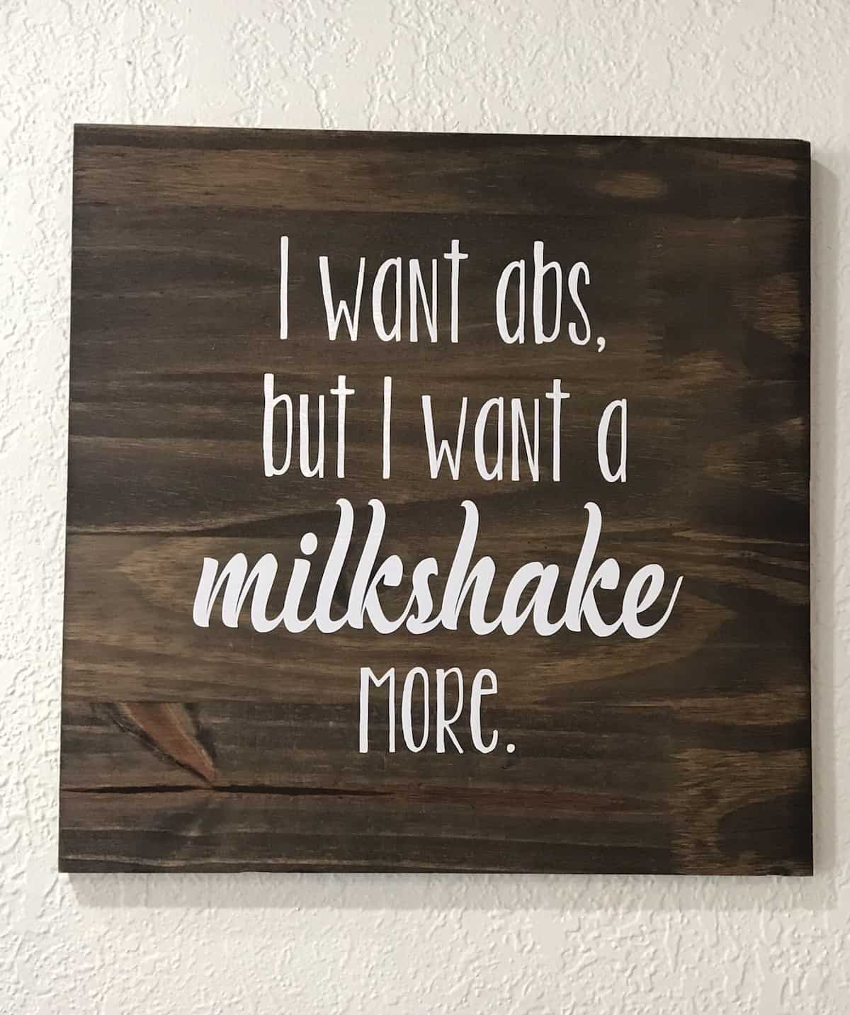 Sign that says I want abs but I want a milkshake more.