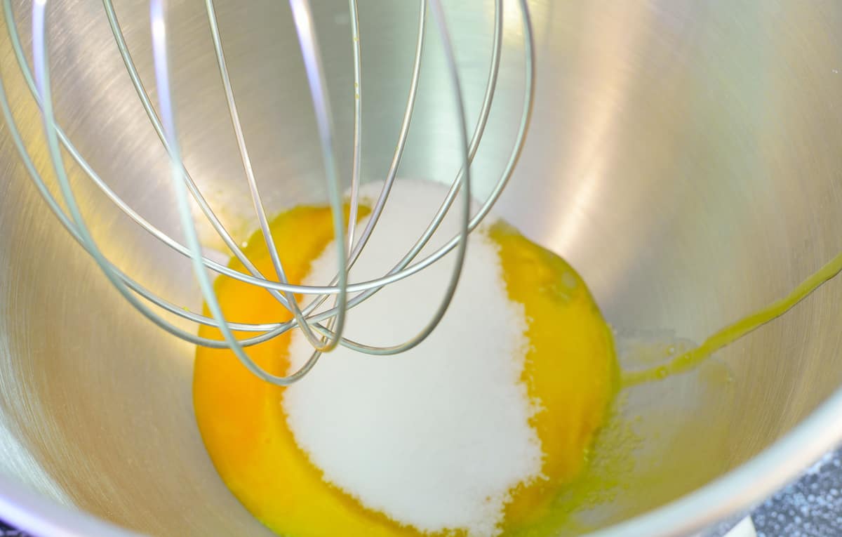 Egg and sugar in a mixer.