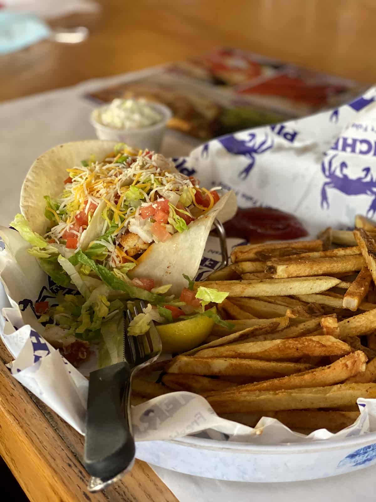 Fish tacos and French fries in a basket at Pinchers.