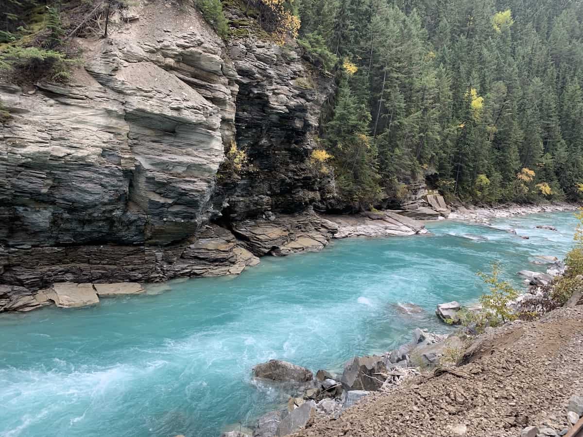 Blue river with mountain in background in Canada.