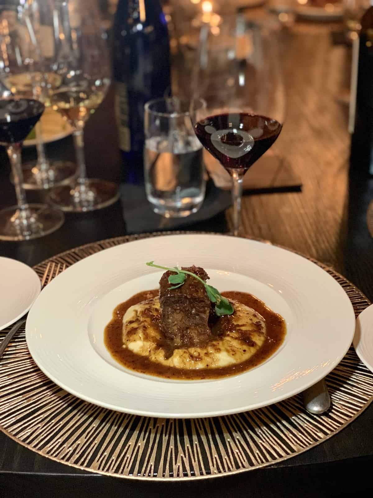 Short rib over mashed potatoes with gravy.