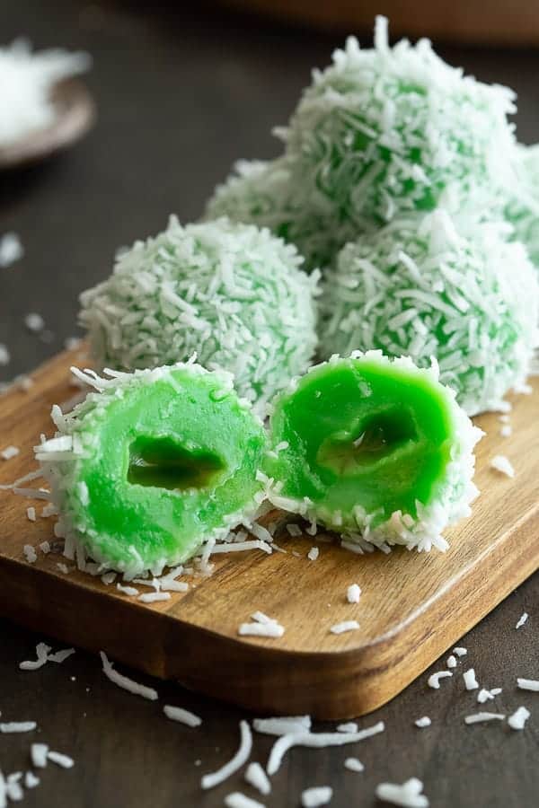 Green Indonesian desserts on a wood board