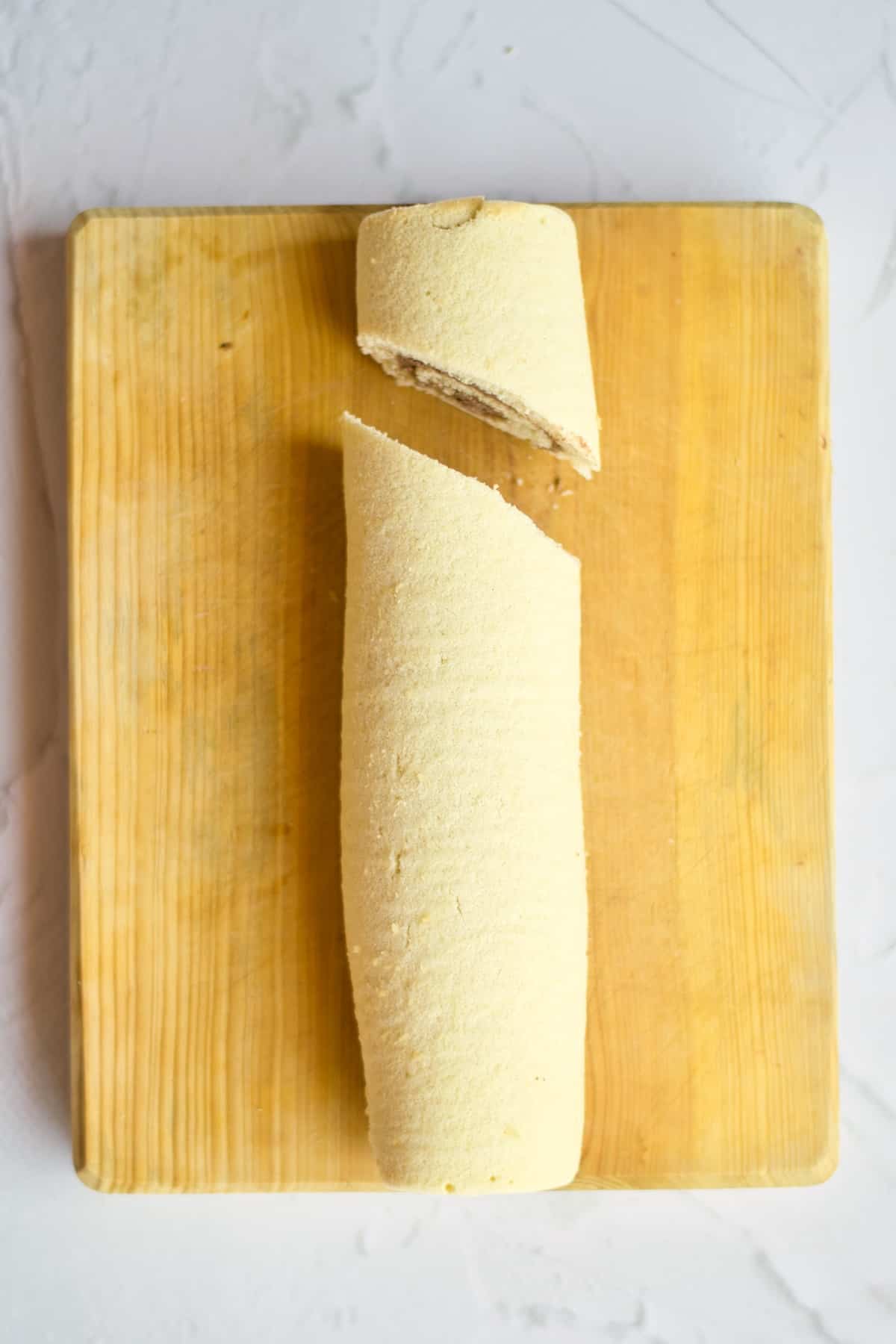 Cake roll with slice set apart.
