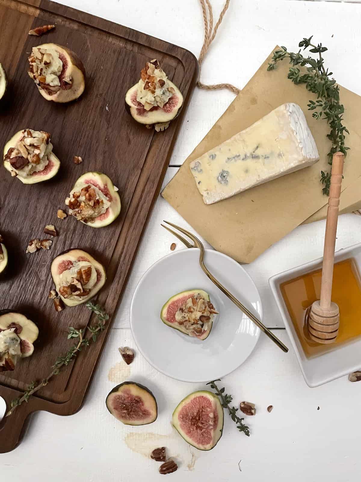 Fresh figs with cheese, pecans, honey, and thyme.