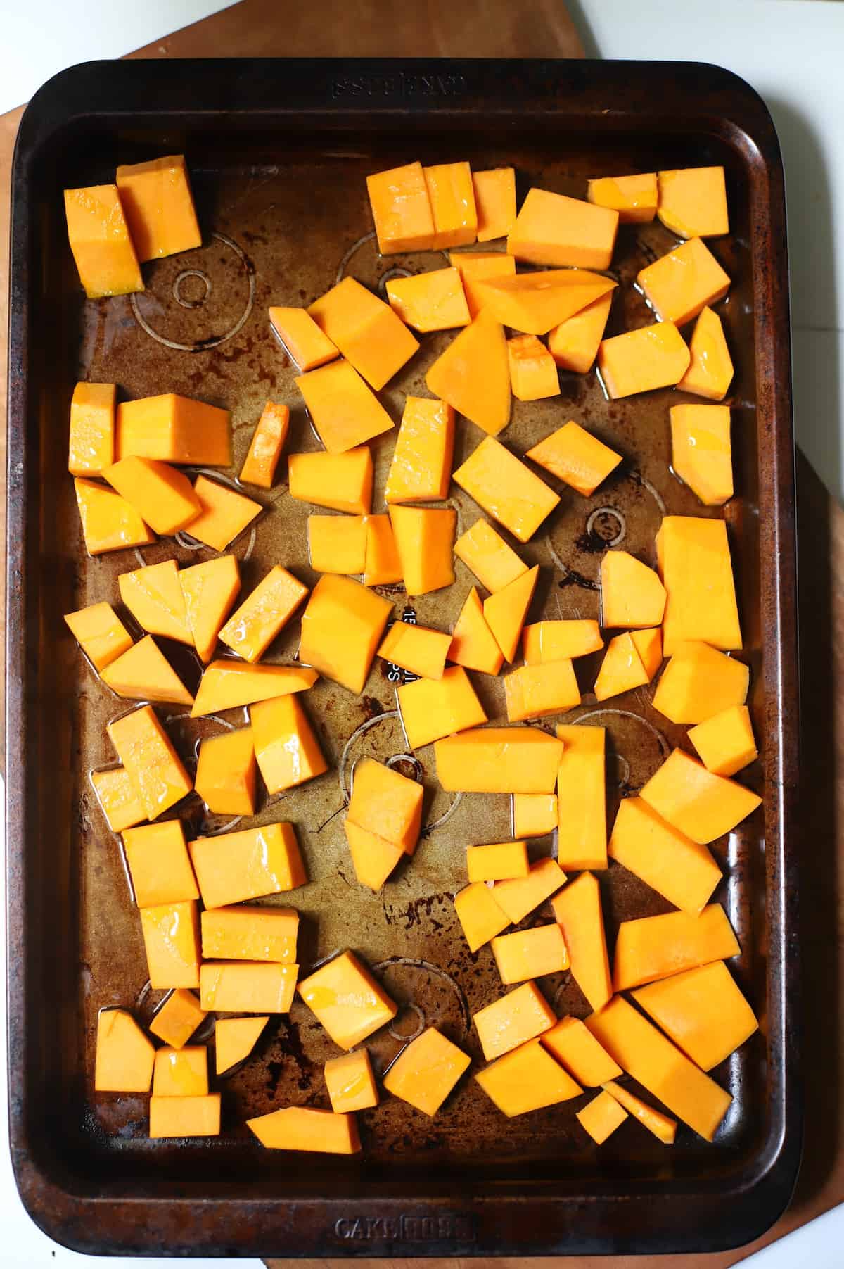 Baking sheet with butternut squash to go in oven.