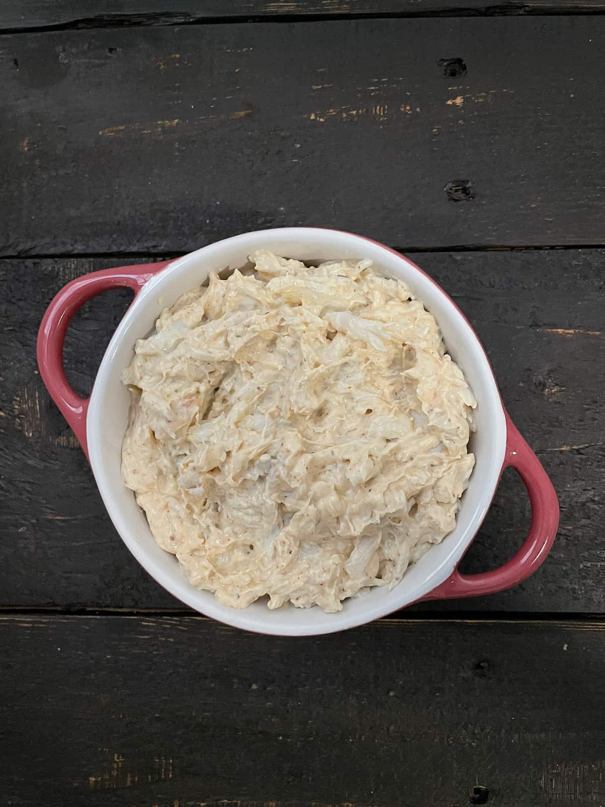 Crab dip in a dish before baking.
