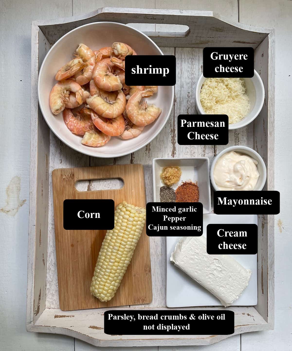 Ingredients for Shrimp dip on a white tray.
