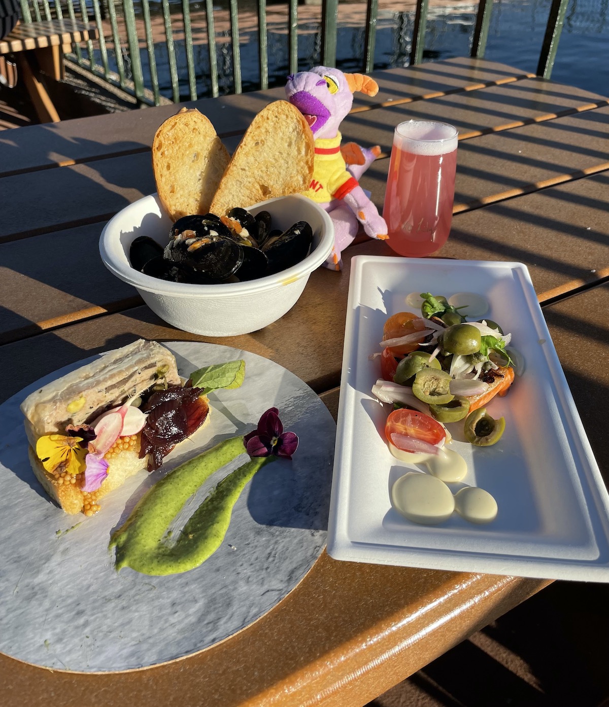 Mussels, pate, and trout at Epcot Festival of the Arts 2022.