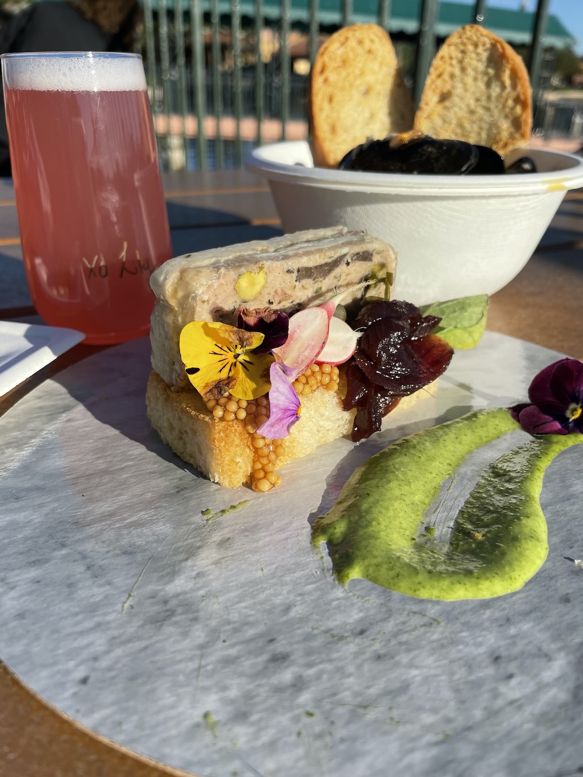 Mussels, pate, and trout at Epcot Festival of the Arts 2022.