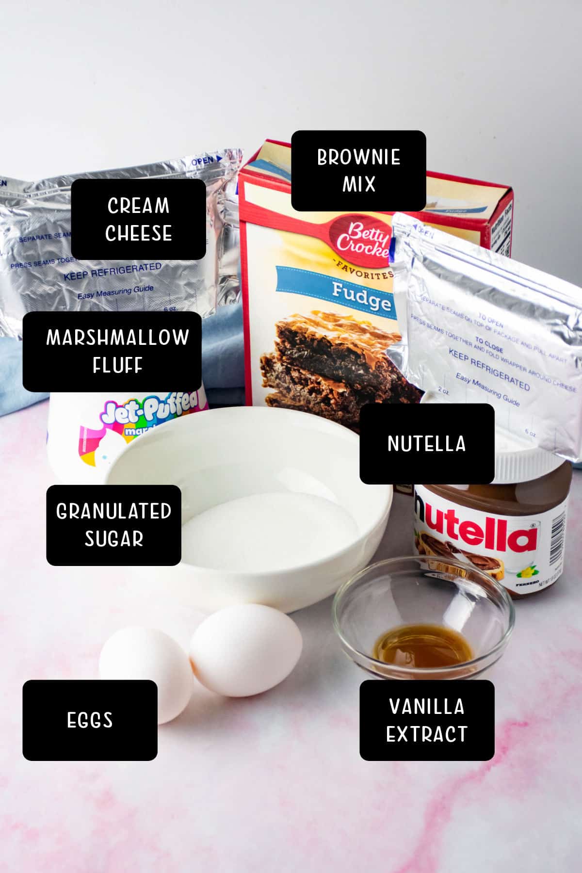 Ingredients for Nutella bars on a marble tabletop.