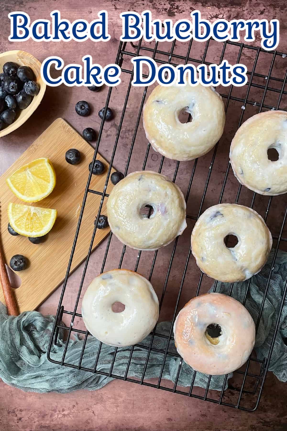 blueberry-donuts-are-stacked-on-a-white-plate