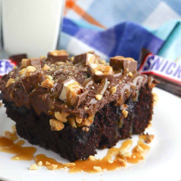 Chocolate cake with caramel, nuts, and Snickers bars.