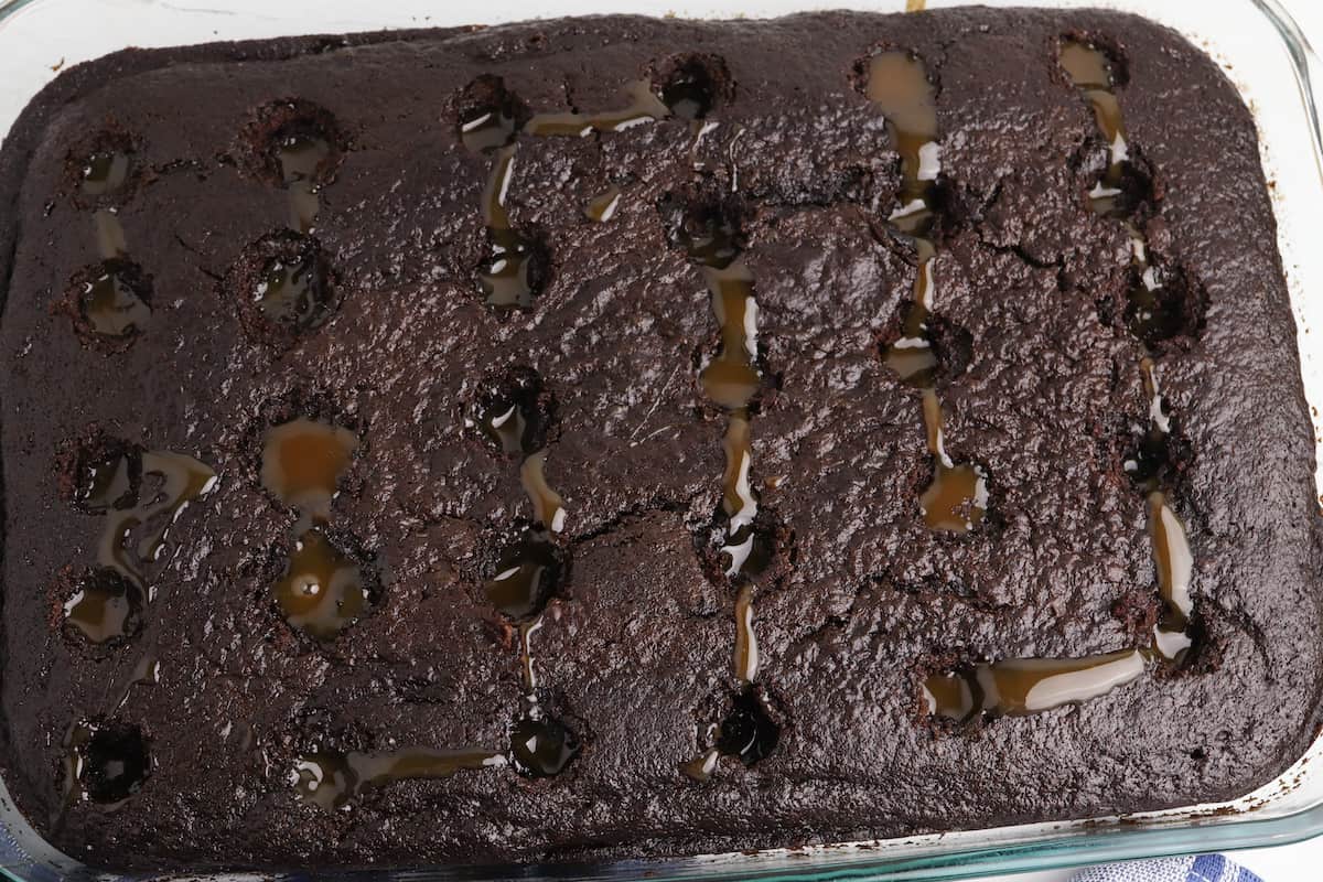 Chocolate cake with holes filled with caramel.