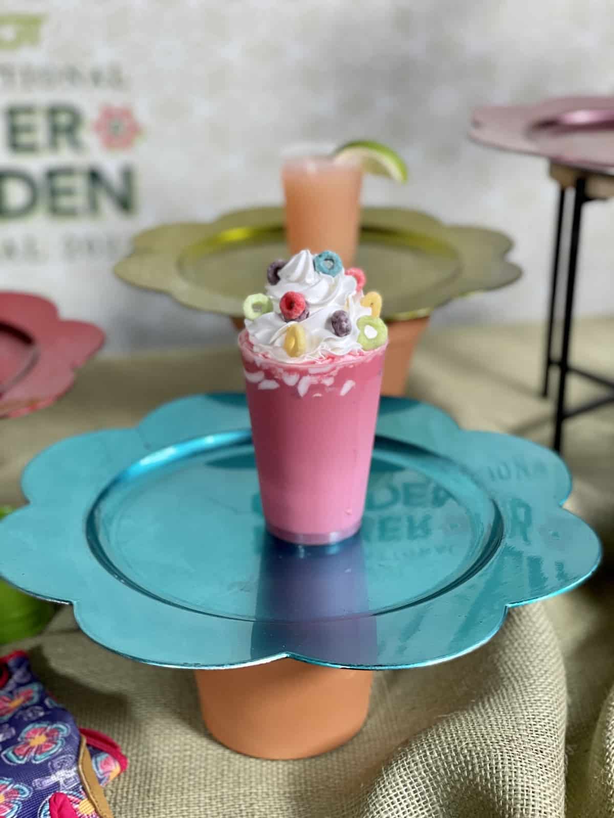 Fruit loop shake on a blue tray.