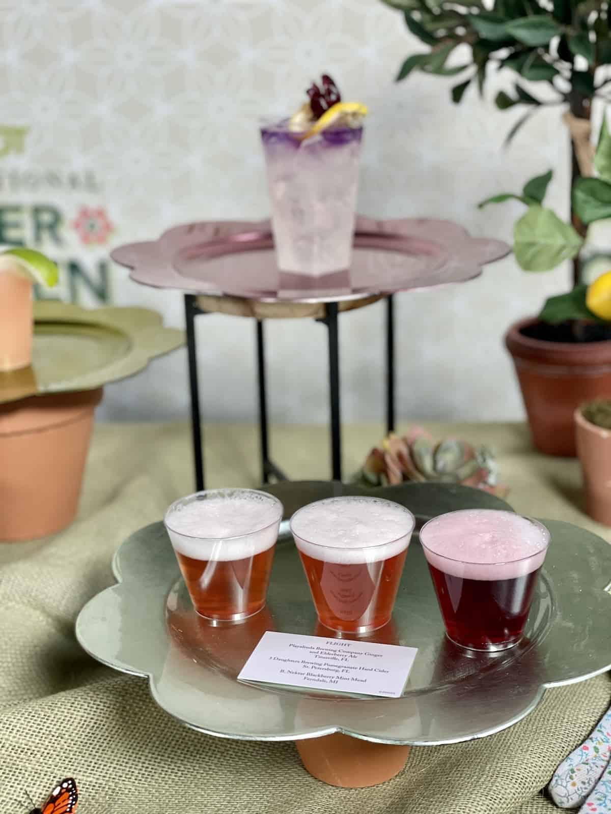 Beer flight on a silver tray.