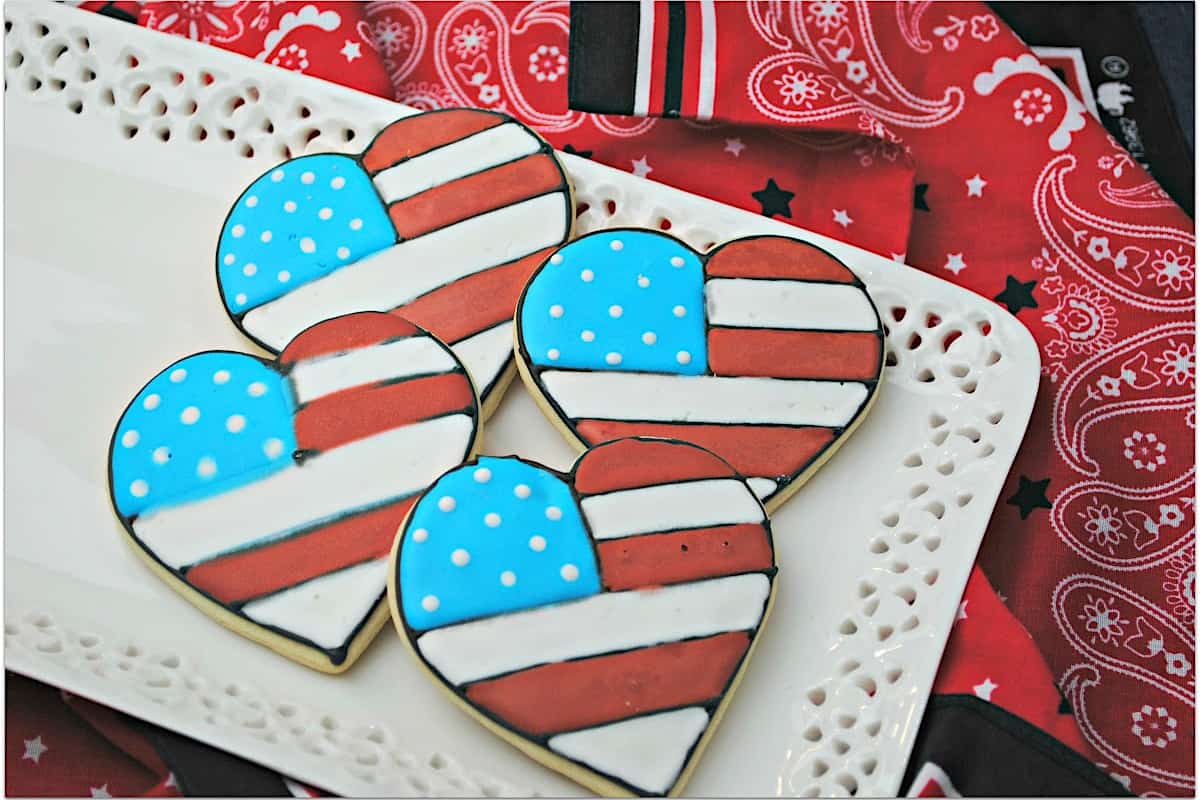 Heart shaped red, white, and blue sugar cookies.