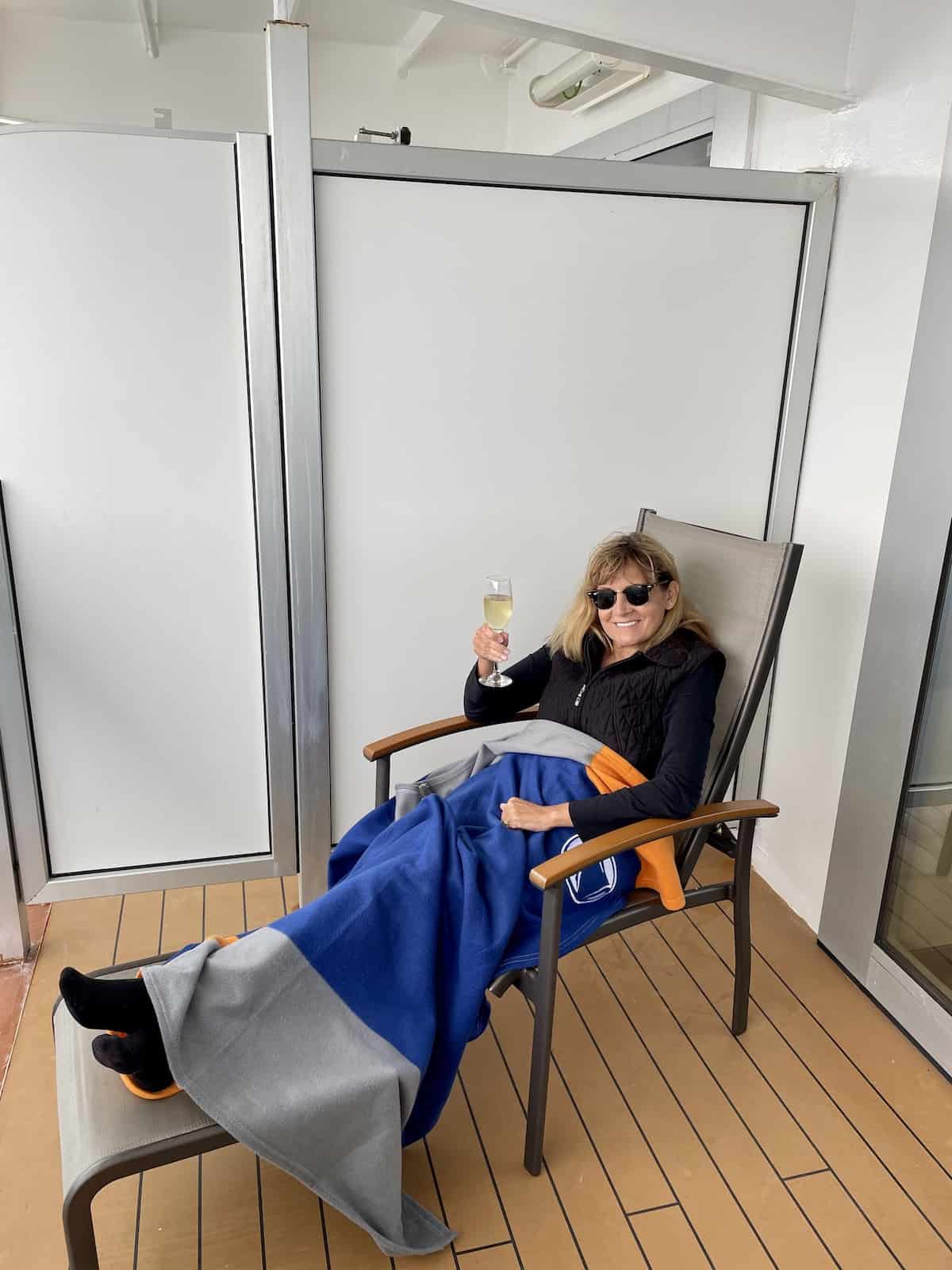 Woman on a verandah of cruise ship.