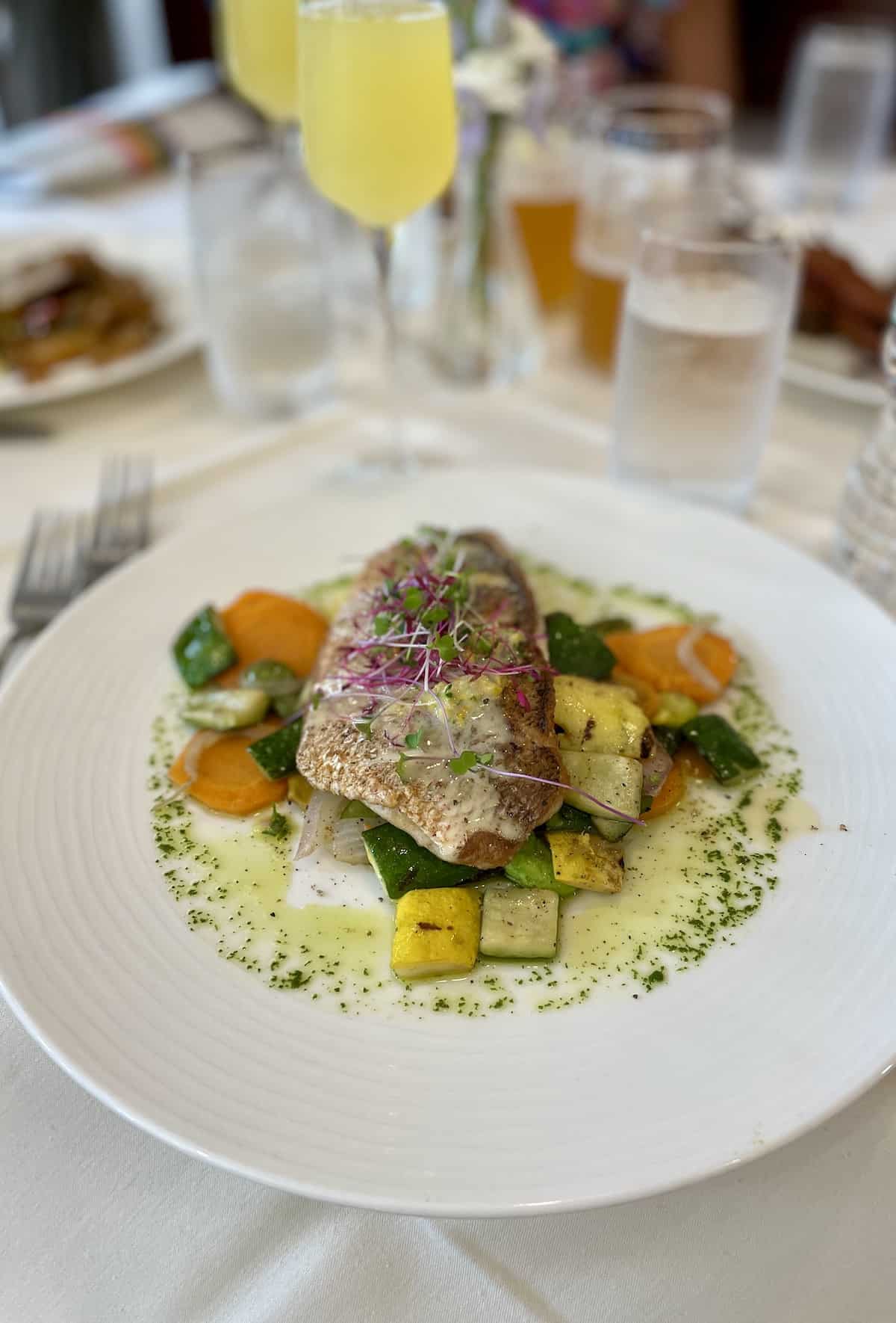 Snapper with lemon sauce and vegetables.