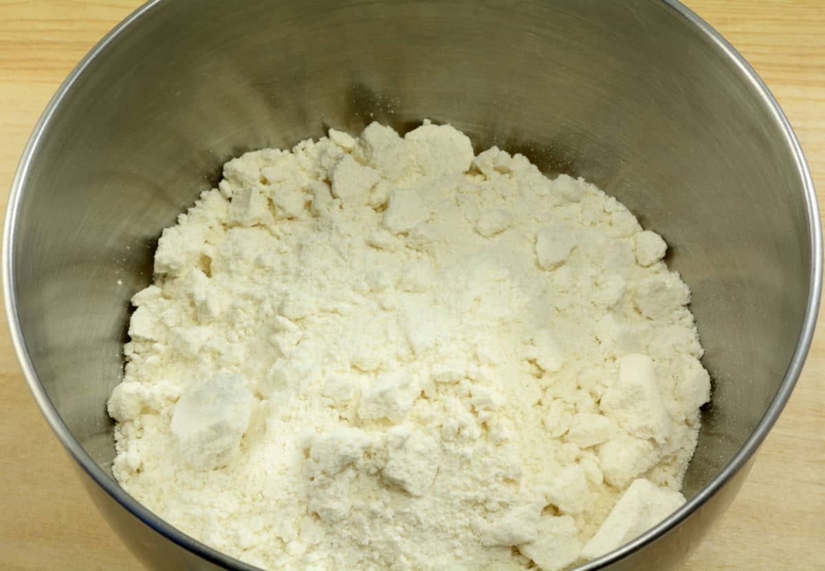 White flour in a stainless bowl.