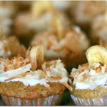 Banana Muffins with slice of dried banana and coconut on top.