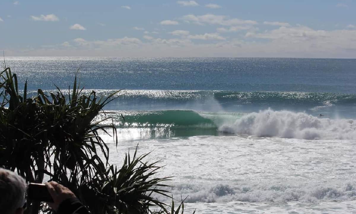 Waves breaking on beach.