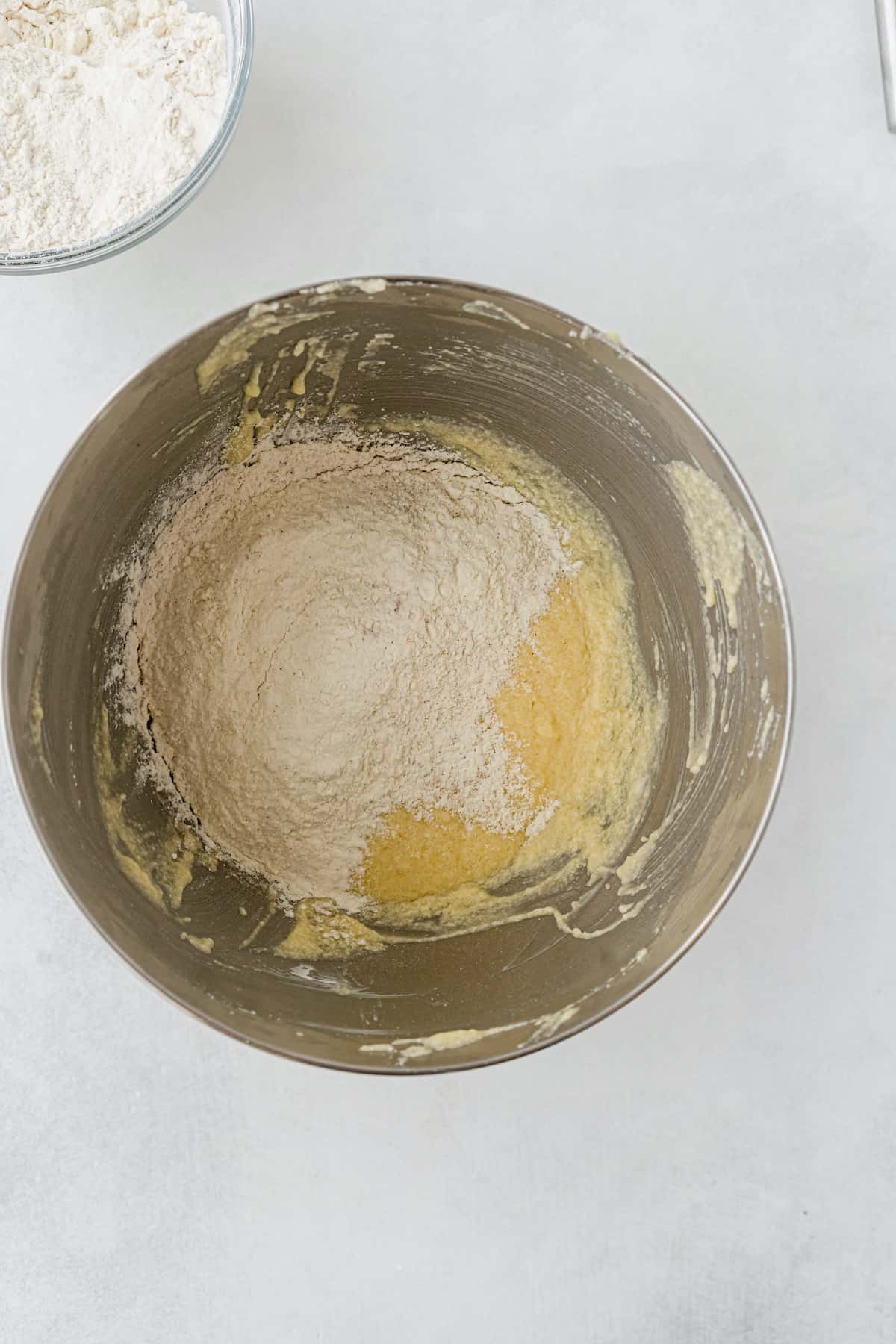 Flour and egg mixture in a stainless bowl.