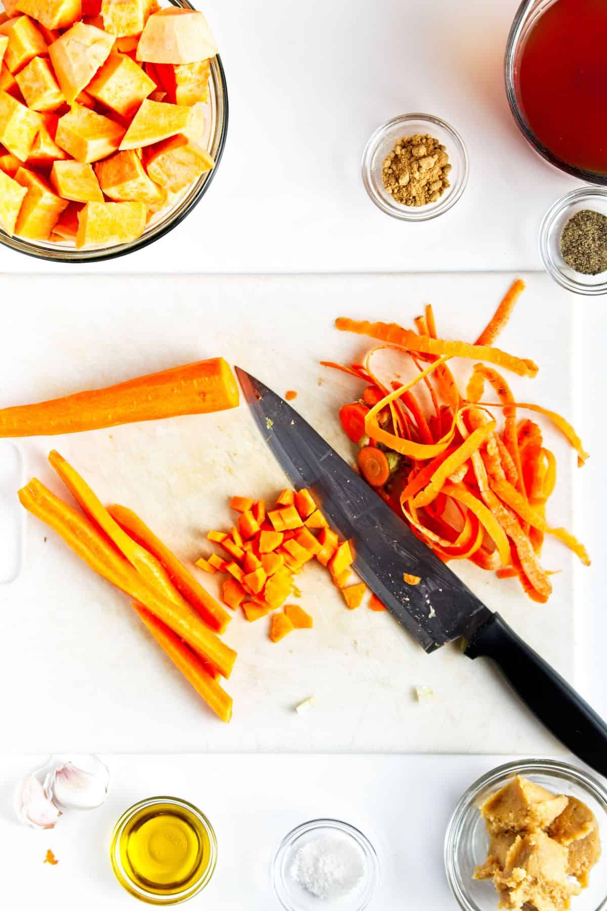 Chopping carrots.