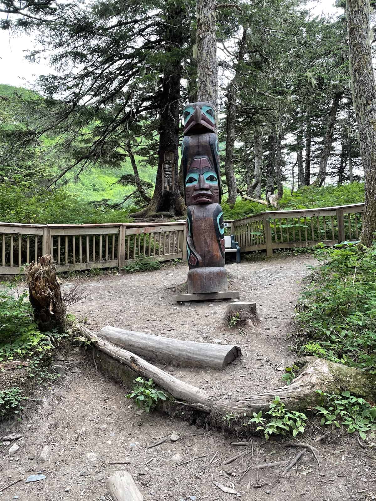 Totem pole in woods.