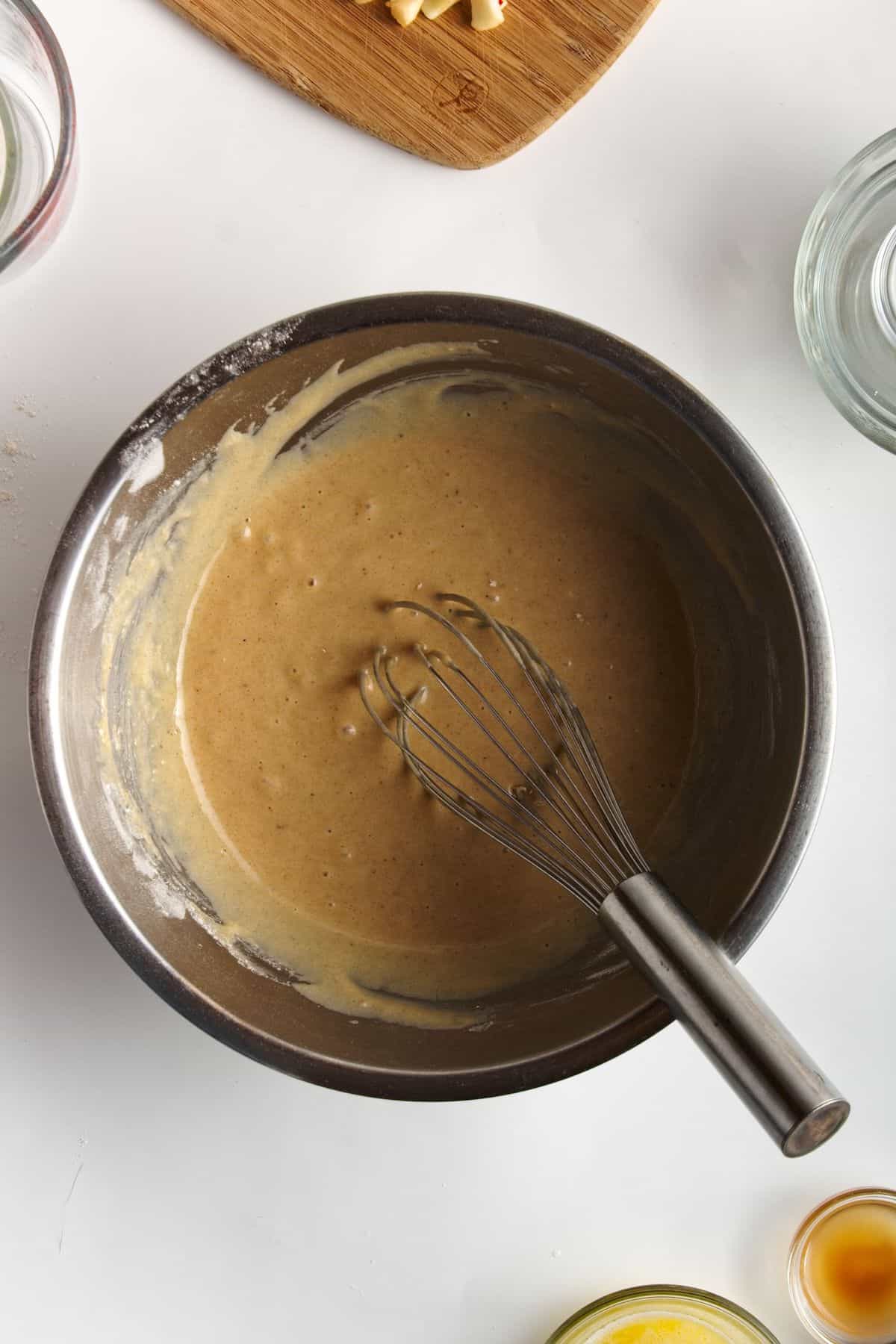 Batter in a stainless bowl.
