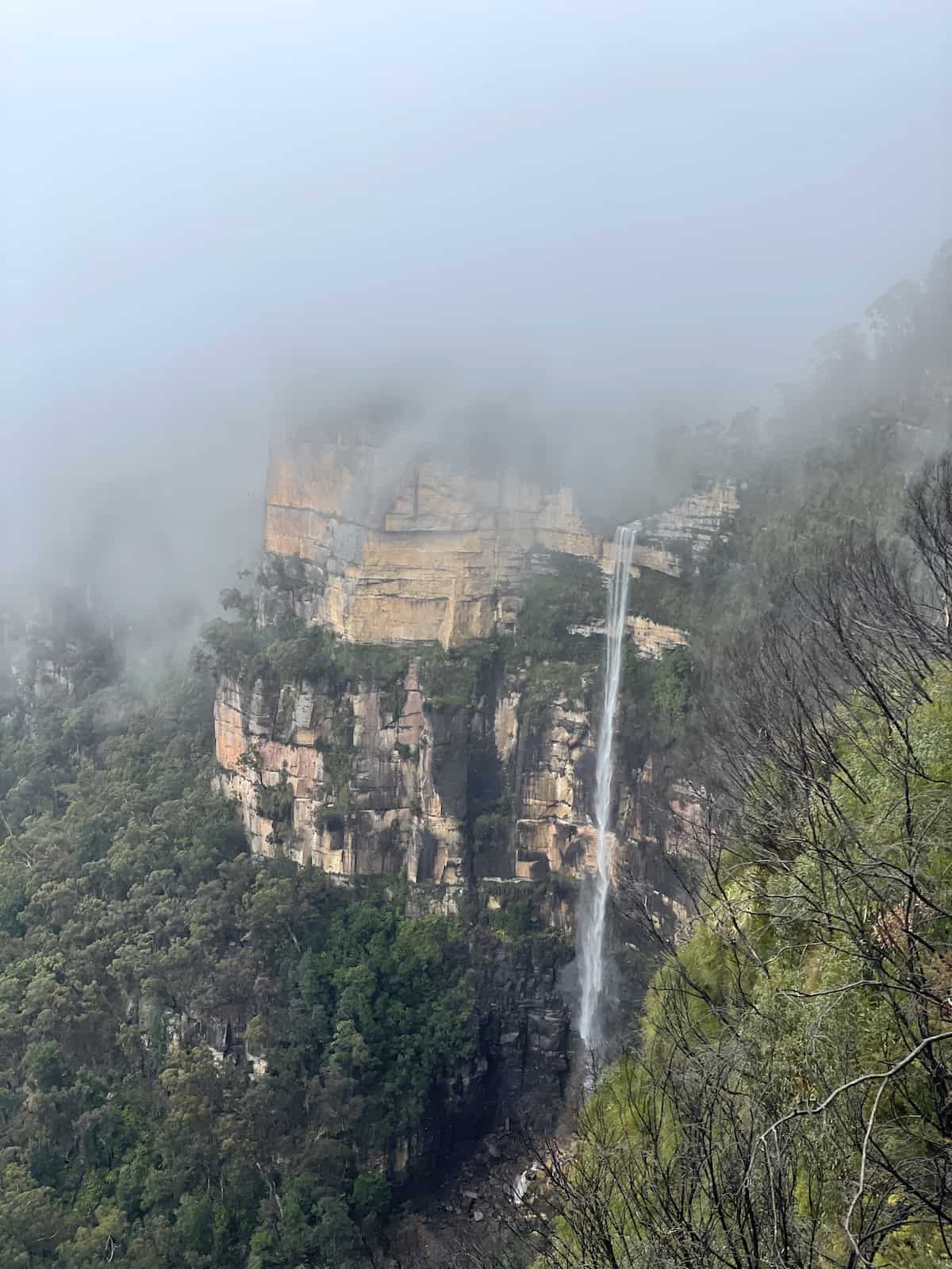 Waterfall though mountain.