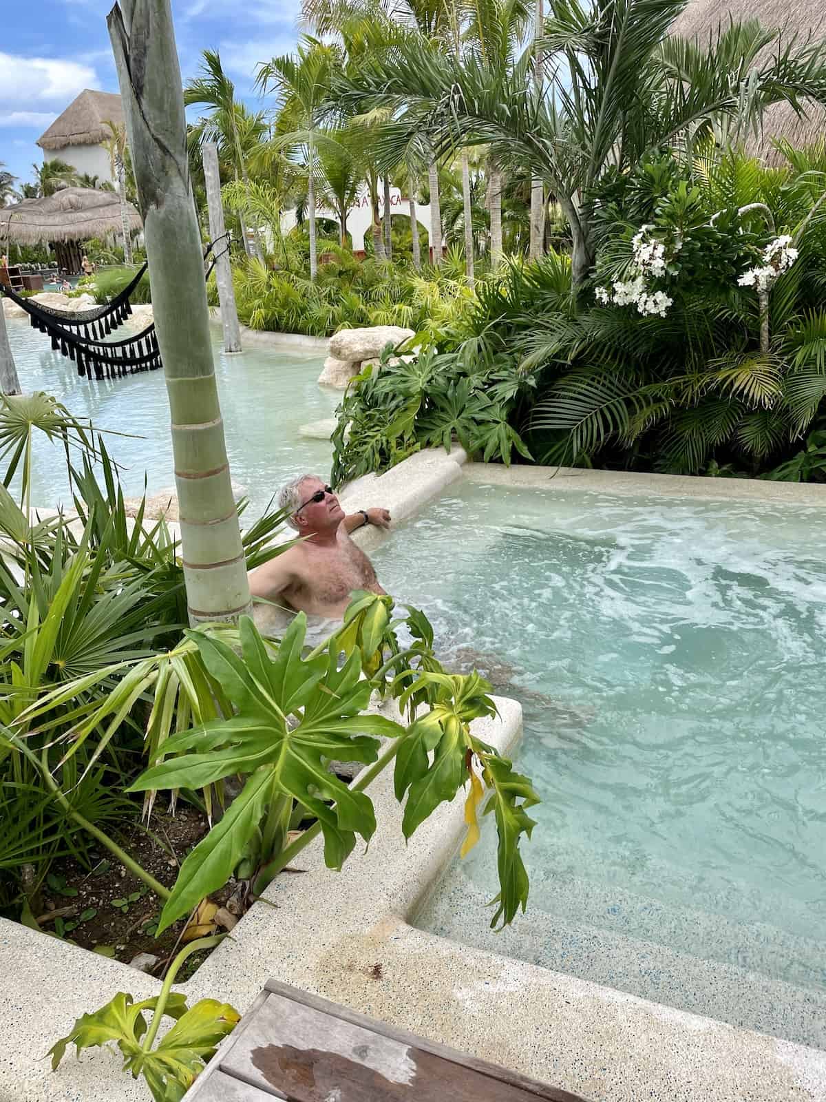 Man relaxing in pool.