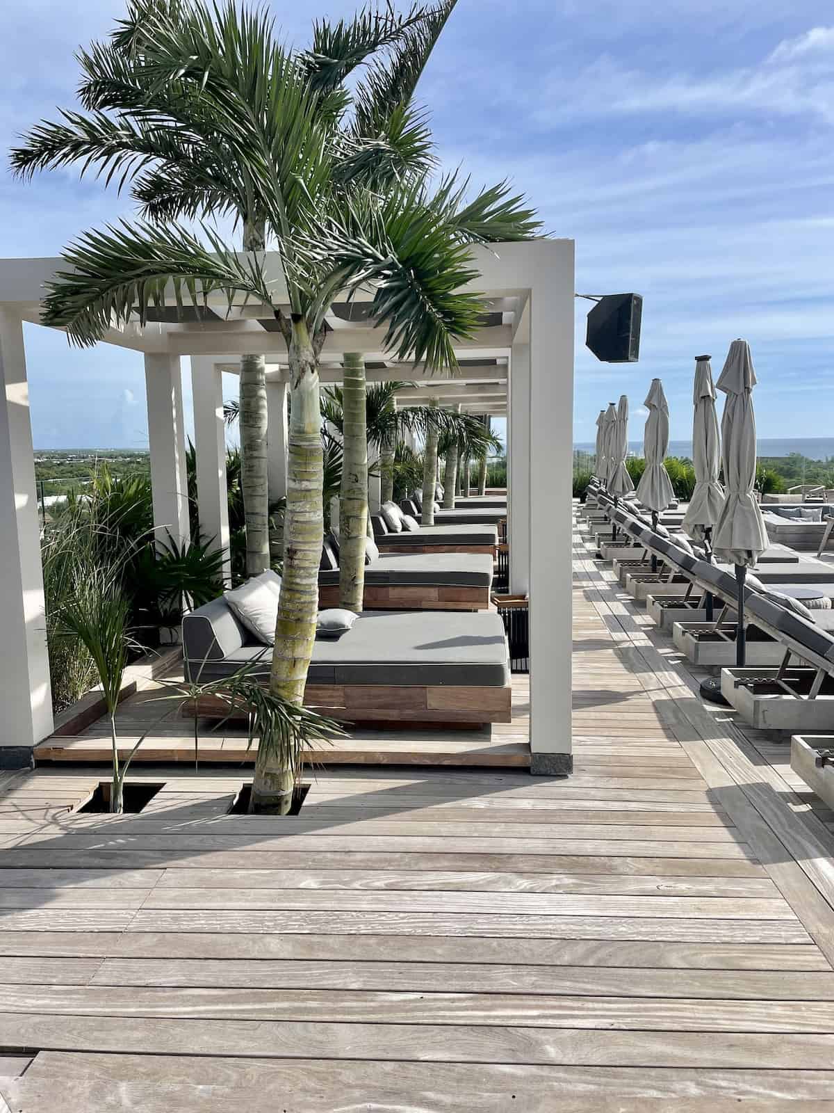 Lounge chairs on rooftop.