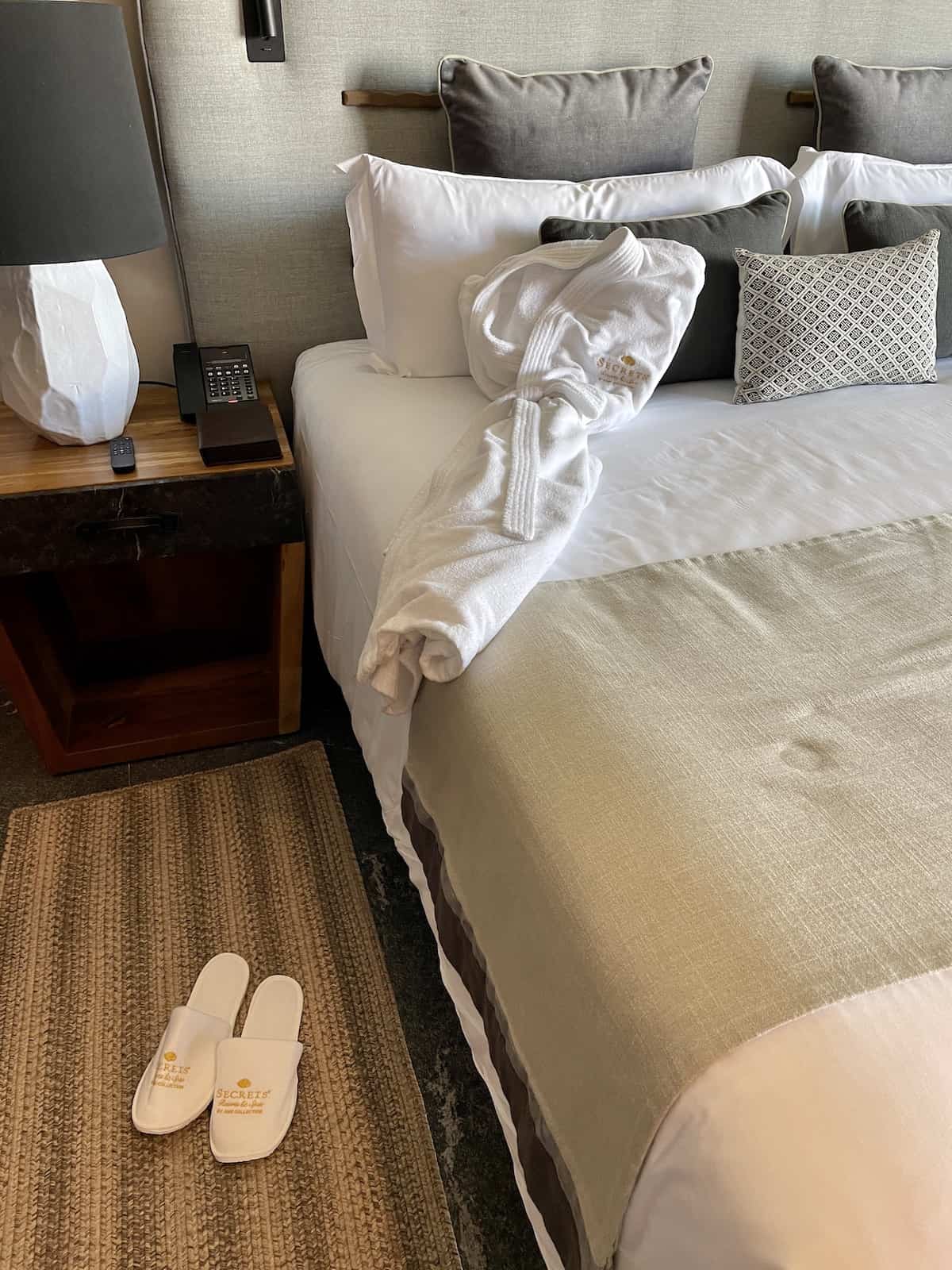 Bed with slippers and robe.