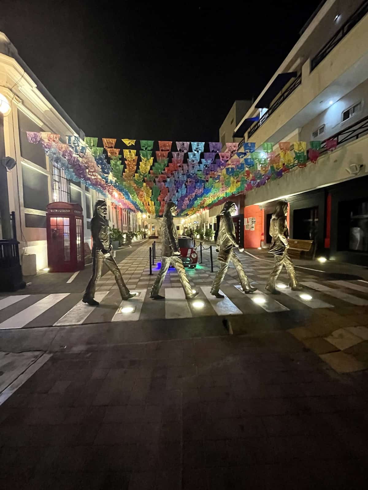 Statues of Beatles walking.