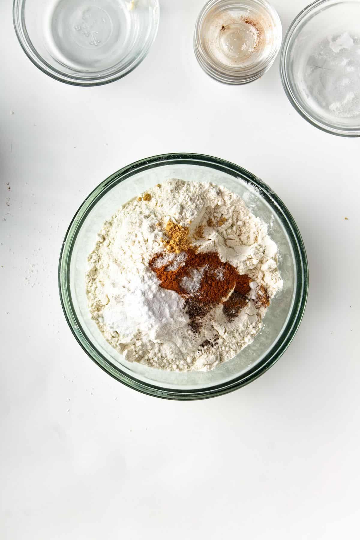 Flour and spices in a glass bowl.