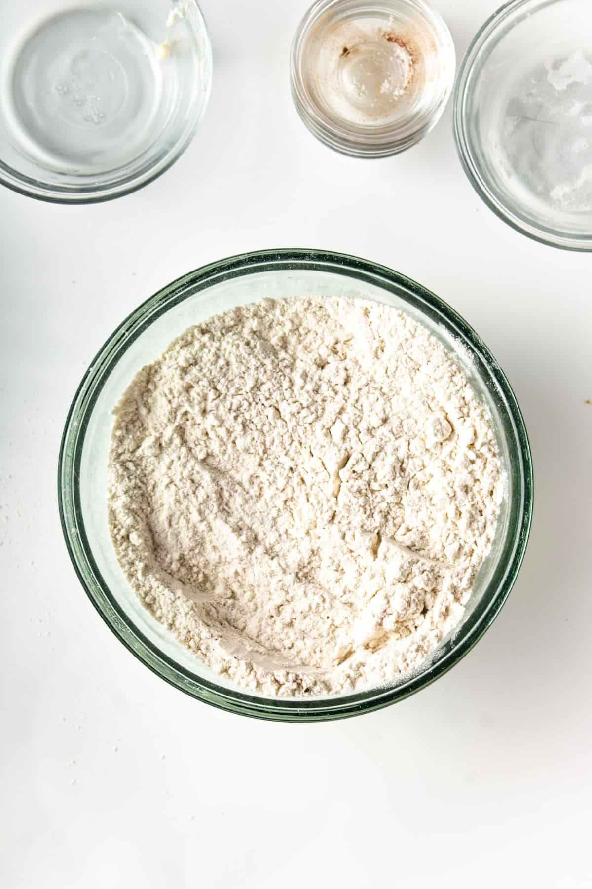 Flour and spices in a glass bowl.