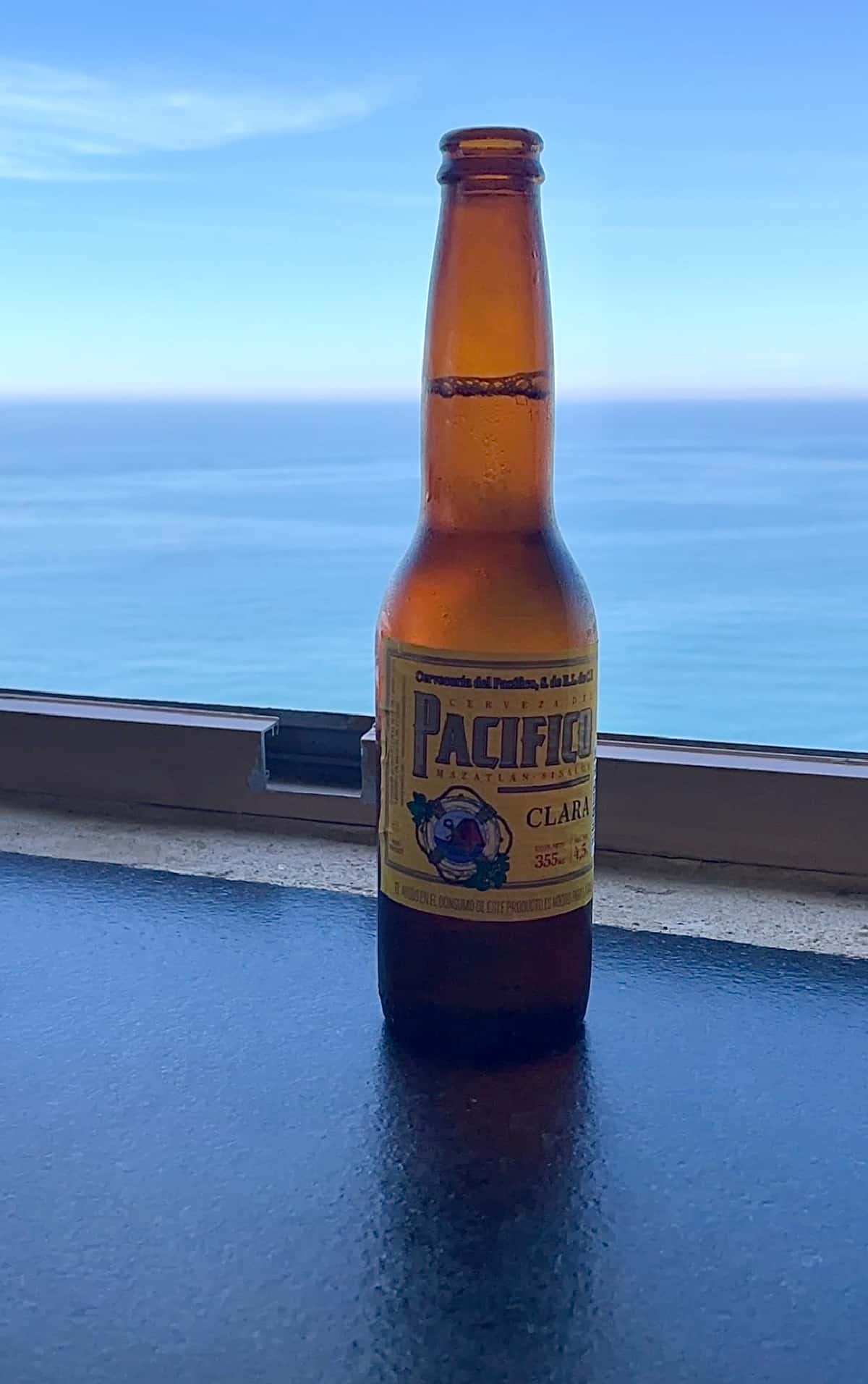 Pacifico beer on ledge of window.