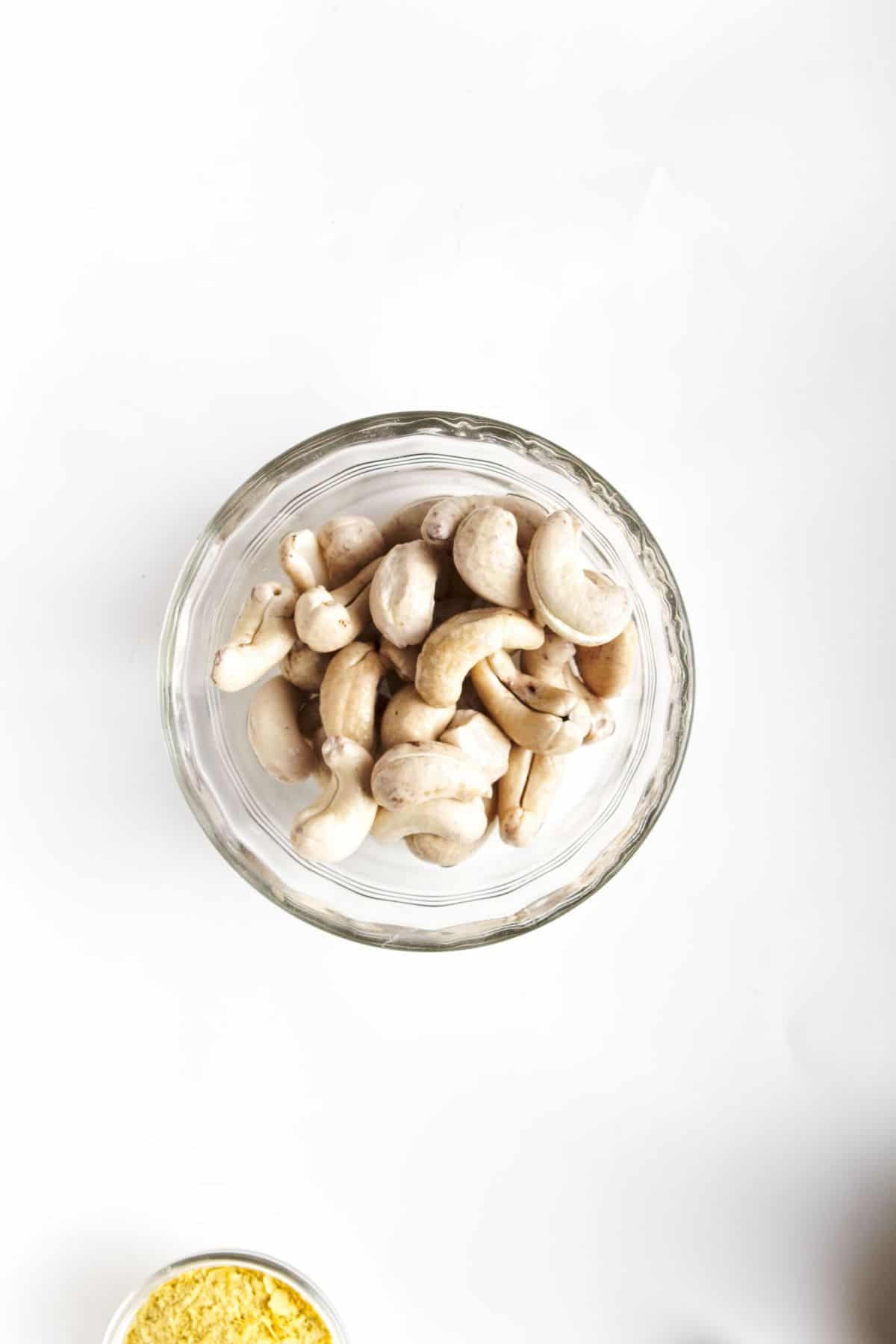 Raw cashews in a blender.