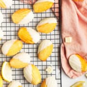 Madeleine cookies on a wire rack with a pink napkin.