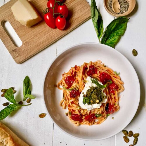 Pasta with tomatoes, ricotta, and pesto.