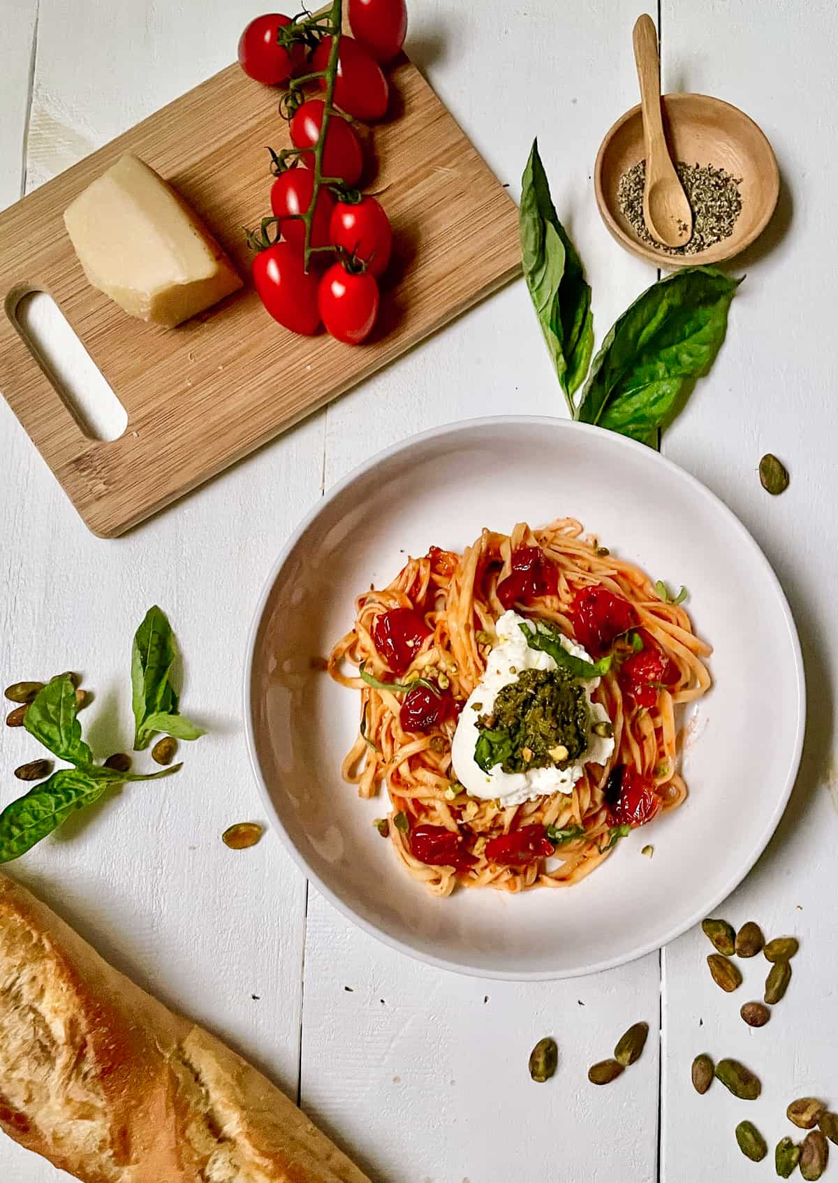 Pasta with tomatoes, ricotta, and pesto.